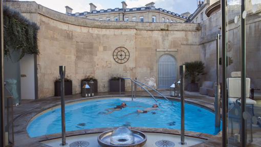 Couple in an open air thermal pool at a spa