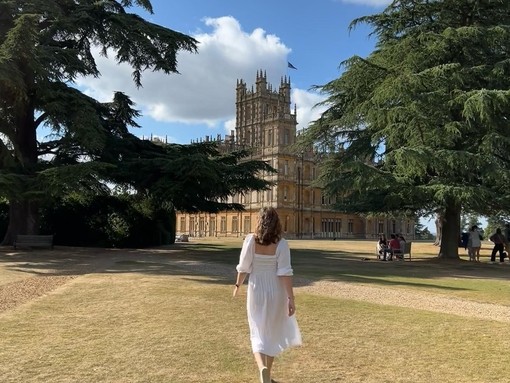 A woman stood outside Highclere Castle, Hampshire