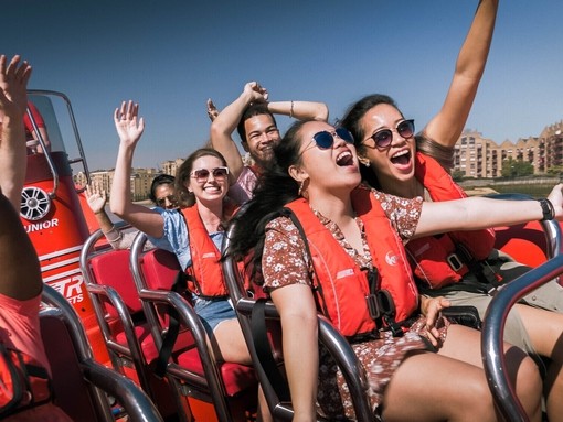 Screaming passengers on a Thames Rocket speed boat