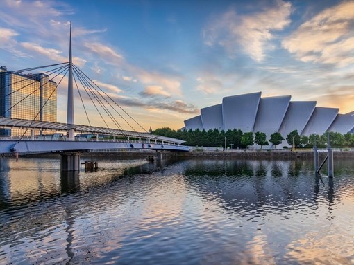 Bell's Bridge and the SEC Armadillo by the river Clyde in Glasgow, at sunrise.