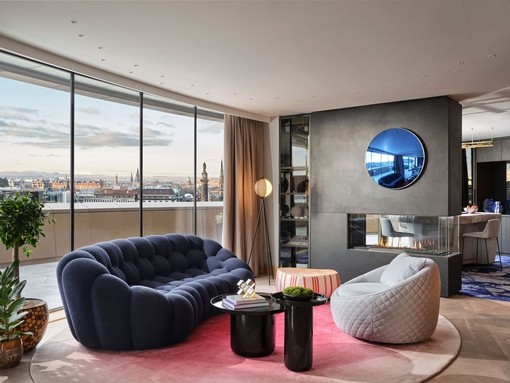 An interior shot of a hotel room in W Edinburgh with panoramic views across the city.
