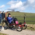 A guest using an accessible four-wheel bike at Hoe Grange Holidays, Derbyshire