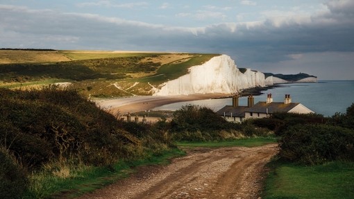 Country road with white cliffs in the background