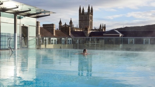 Woman in the swimming pool, Thermae Bath Spa, Bath, Somerset, England.