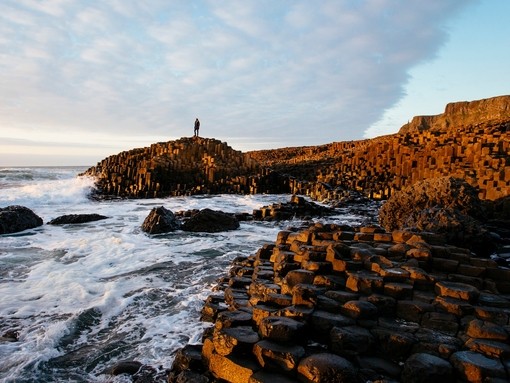 Sunset over the red basalt column. Sea views
