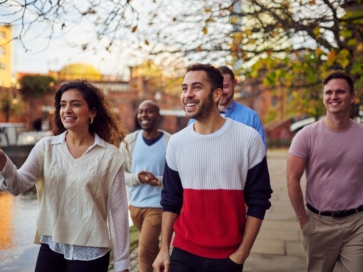 Group of friends walking by the canal in Castlefield