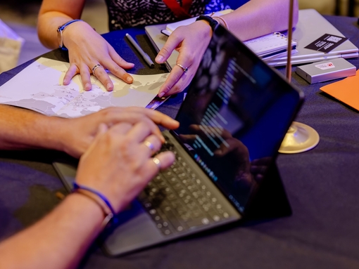 Hands gesture during a meeting at a table at an event