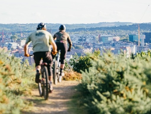 People riding bikes on the inner city mountain bike trails at Parkwood Springs, Sheffield