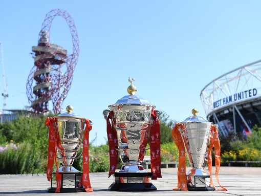 Three trophies from Rugby League World Cup placed on the ground in Queen Elizabeth Olympic Park