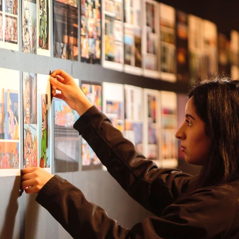 Woman arranging display in a museum