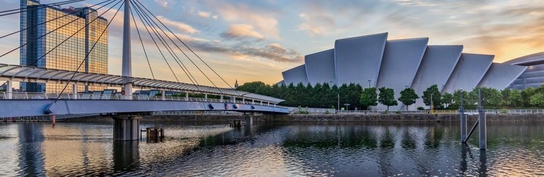 Bell's Bridge and the SEC Armadillo by the river Clyde in Glasgow, at sunrise.