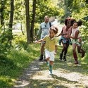 A shot of a diverse family walking in the countryside.