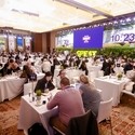 Groups of people sitting at tables discussing business at Destination Britain China